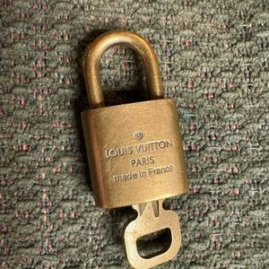 Louis Vuitton pad lock.  330  good condition